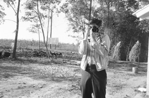 Jim Peppler, photographer for The Southern Courier, in the yard of the Bracy family in Elmore County, Alabama.